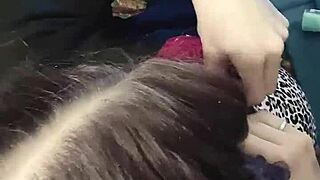 Brunette babe clamps nipples in close up