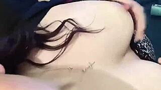 Brunette babe clamps nipples in close up