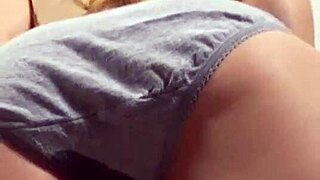 Blonde girl caught peeing in her panties during a private moment.