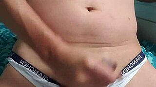 Gay boy masturbates in underwear.