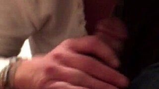 mature white woman sucking on a small black cock in a trashy setting