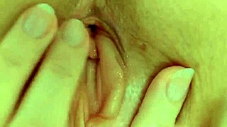 Close up of a hot milf’s pink pussy as she is fingered by her husband
