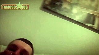 Gay man explores intimate desires in a private bedroom setting