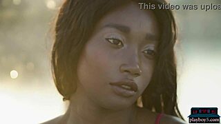 Beautiful ebony babe Mimi Desuka undresses and strips naked in the pool for Playboy