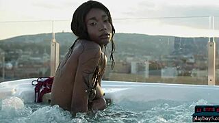 Beautiful ebony babe Mimi Desuka undresses and strips naked in the pool for Playboy