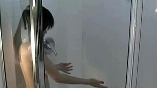 Japanese Babe with Natural Tits Fingers Herself in Steamy Shower