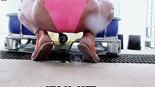 staci sits in her pink panties, getting her feet wet in this fetish video