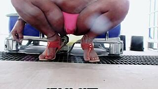 staci sits in her pink panties, getting her feet wet in this fetish video