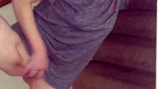 wife with tattoo and piercing rubs shaved pussy on stairs