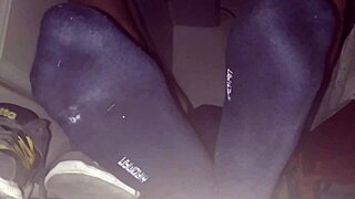 Blue sweaty socks and bare feet end with a sticky cumshot.