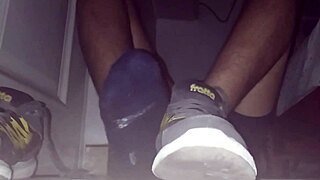 Blue sweaty socks and bare feet end with a sticky cumshot.