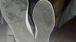 Blue sweaty socks and bare feet end with a sticky cumshot.