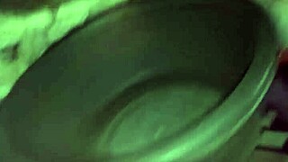 A gay man with painted lips shoves a whole pack of butter up his ass