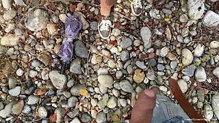 busty milf risks exposure during passionate river fuck