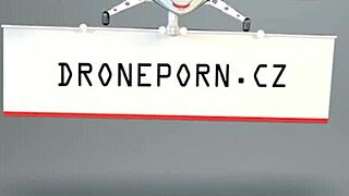 two lesbians switch butt plugs in a casual scene