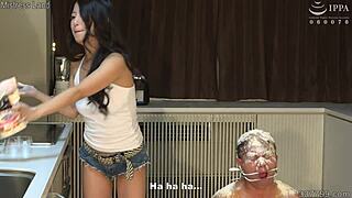 Japanese Femdom Satomi Uses Slave as Human Ashtray in Kitchen