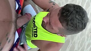 gay blowjob happens on public beach under the sun