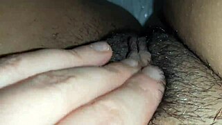 I teased my big clit with tickling fingers until reaching a shuddering orgasm.