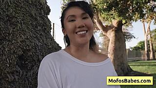 Hey, check out this hot Asian teen showing off her big natural boobs outside!