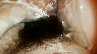 Hairy bush dripping wet underwater in close-up fetish pussy video