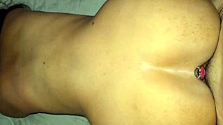 Damn! Watch me take it doggystyle with a plug stretching my tight ass!