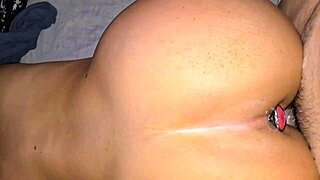 Damn! Watch me take it doggystyle with a plug stretching my tight ass!