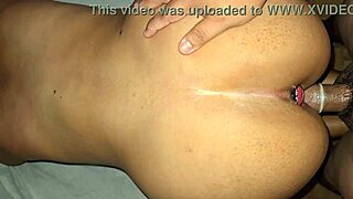 Damn! Watch me take it doggystyle with a plug stretching my tight ass!