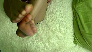 Hey, this sexy blonde gives a sensual footjob before bed, cum on feet!