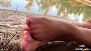 Autumn river bank, teasing toes in nude tights