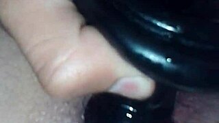 Jimena Simpson, a stunning tranny, pounds a black dildo in wild action