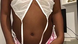 A latina woman in lingerie showcases her sexy solo performance for amateurs