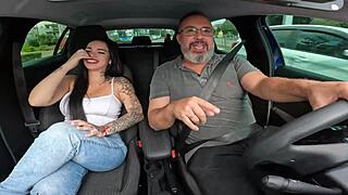 Anna Belutti, the naughty shorty, rides the driver's bare cock in the car