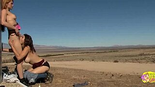 Brunette and blonde lesbians boldly eat pussy and trib outdoors despite the open air