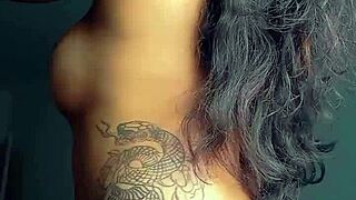 The tattooed prostitute showcases her body in a steamy anal session