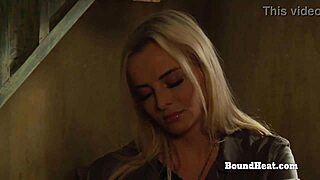 This big ass lesbian slave is bent over, getting fingered and spanked