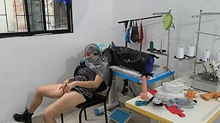 indian seamstress enjoys quiet time in workshop