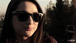 two lesbian bodies kiss and lick on a small bed