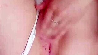 Hot babe in white panties teases by massaging her tits. She rubs her wet pussy right on camera.