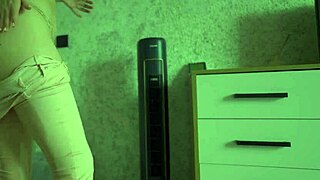 A Woman Experiences Desperation And Pees In Her Jeans At Home.