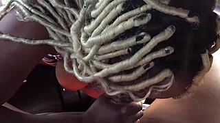 in the backseat, a black amateur gives a blowjob in the car