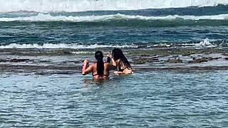 two pretty girls enjoy the beach at enseada dos corais in cabo