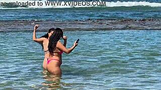 two pretty girls enjoy the beach at enseada dos corais in cabo