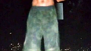 IN THE PARK, A MATURE BEAUTIFUL WOMAN DOES A HOMEMADE PHOTOSHOOT AT THE GYM FOR AN INTERVIEW