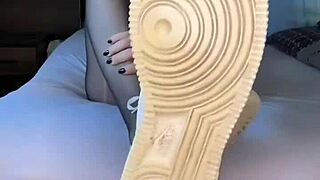 Girl's nylon-clad feet in Nike Air Force ignite fetish desires