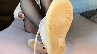 Girl's nylon-clad feet in Nike Air Force ignite fetish desires