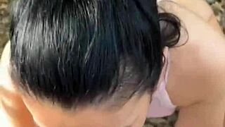 She sucks his dick in the woods, amused by honks!