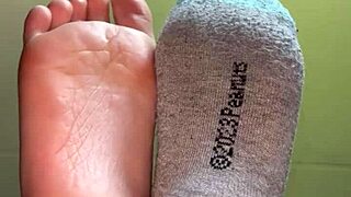 White girl showing her feet in socks for cash payment