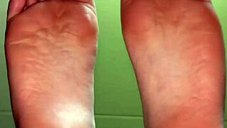 White girl showing her feet in socks for cash payment