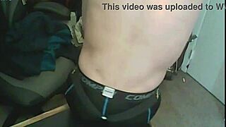 Stretching with massage gun with compression tights and brace bound