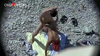 on the beach, a curvy milf blows a guy and gets doggystyled publicly.